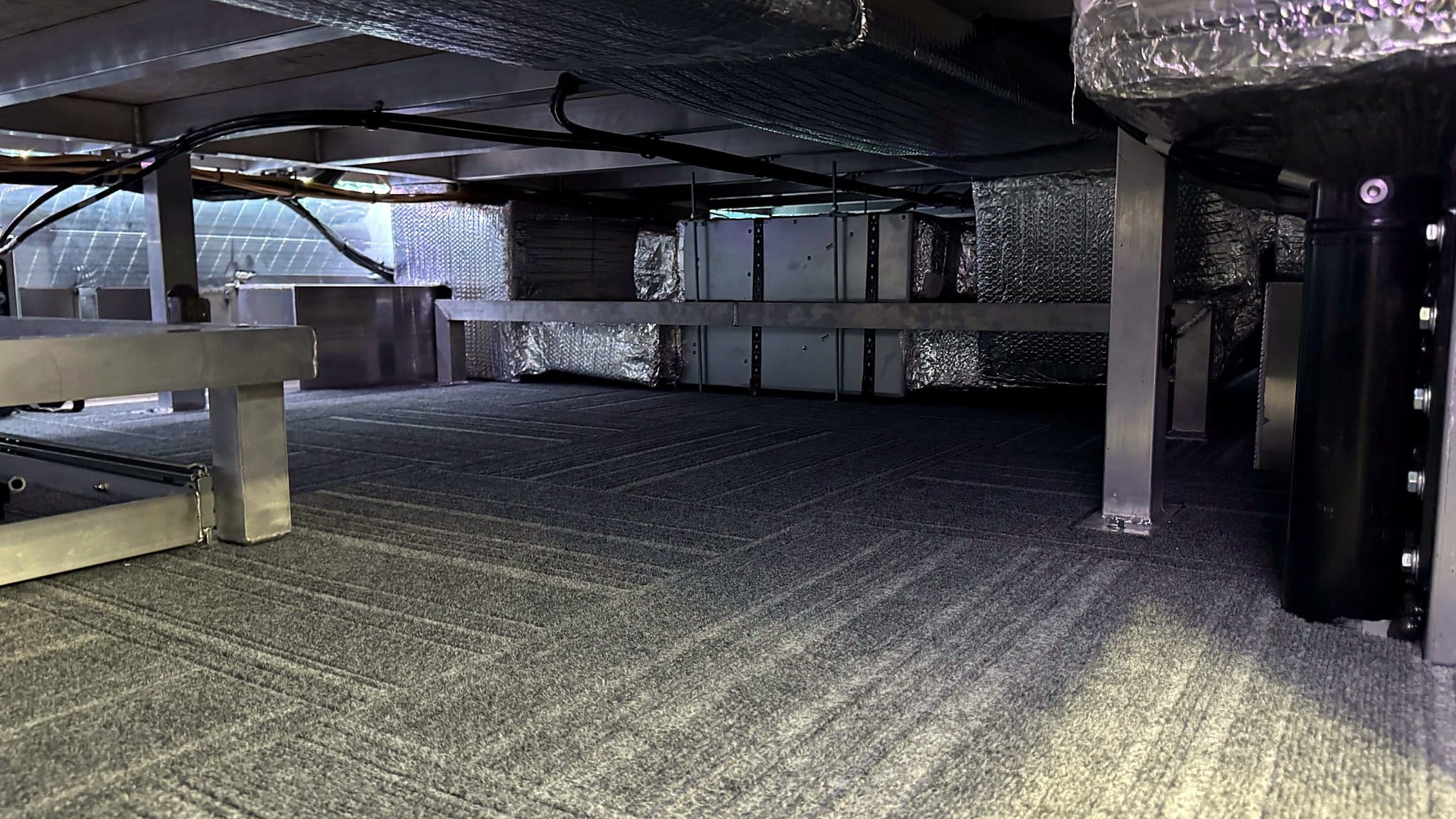 Full-width illuminated basement equipment storage